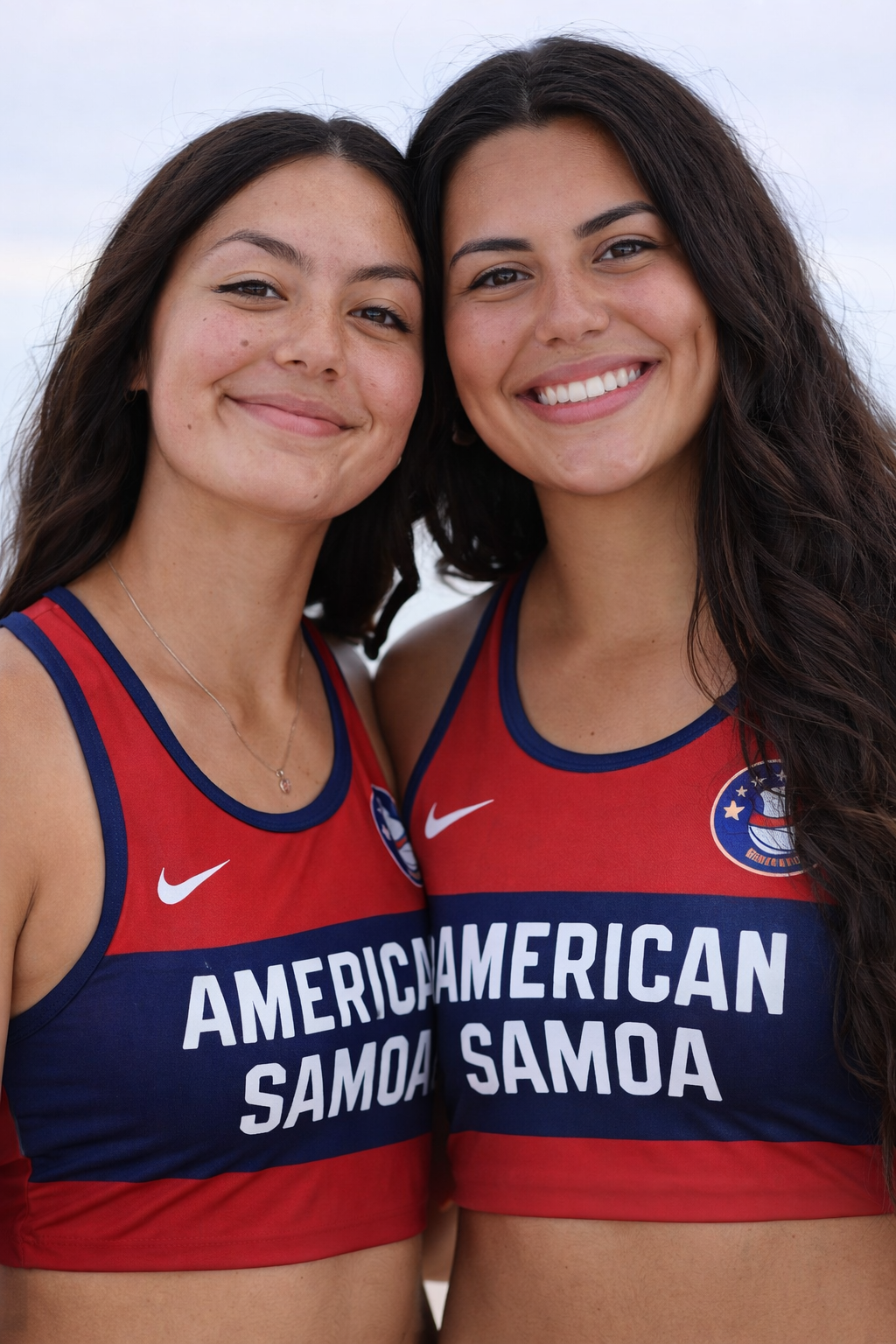 Two American Samoa beach volleyball athletes in team jerseys