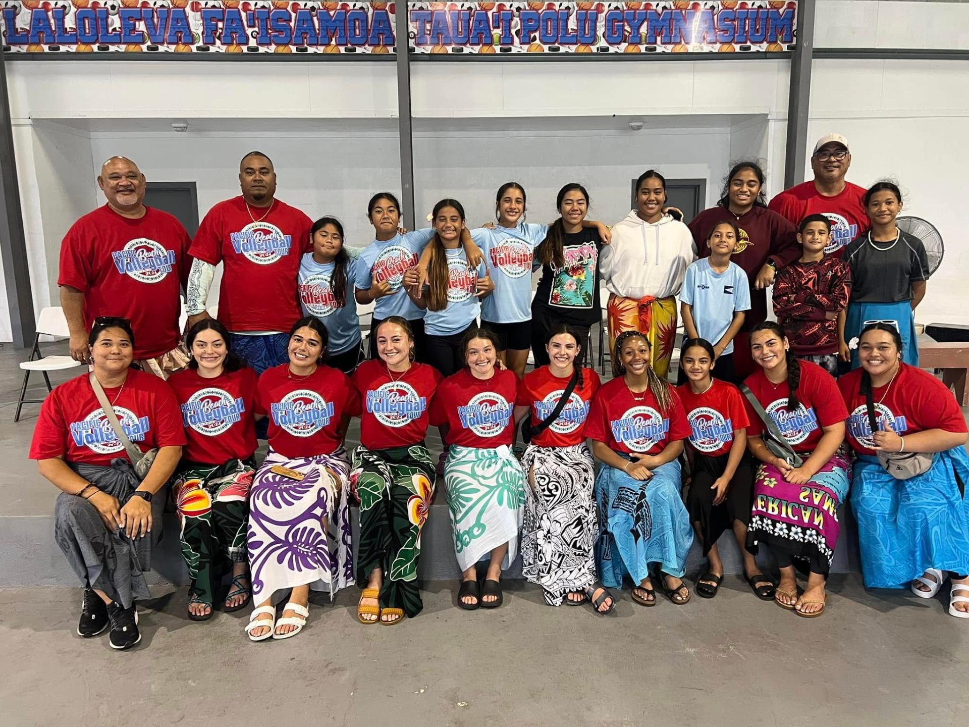American Samoa Beach Volleyball team and youth athletes together at the gymnasium
